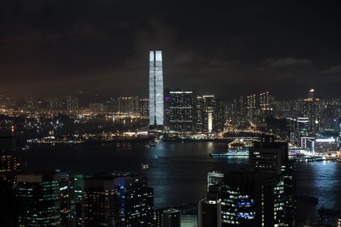 Carsten Nicolai's "a (alpha) pulse" illuminates the ICC building as part of Art Basel in Hong Kong. Photo: AFP