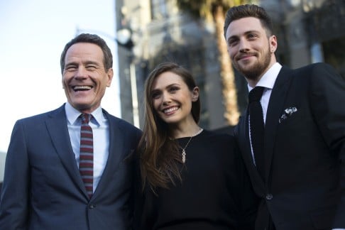 Cast members Bryan Cranston (left), Elizabeth Olsen  and Aaron Taylor-Johnson  at the premiere of "Godzilla" in  Hollywood. Photo: Reuters