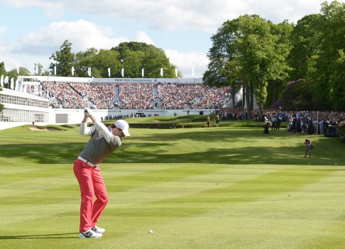 Rory McIlroy hits to the green on 18. Photo: AP