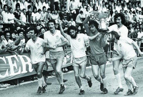 Seiko players, including Derek Currie (third from left), run a lap of honour after winning the FA Cup on May 25, 1975.