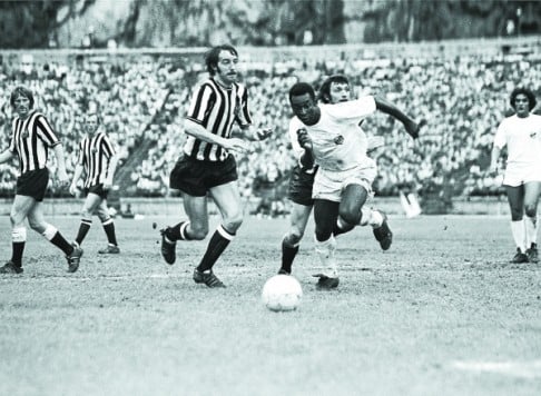 Pele takes the ball during a Santos vs Newcastle United exhibition match in Hong Kong in 1972. Santos won 4-2.