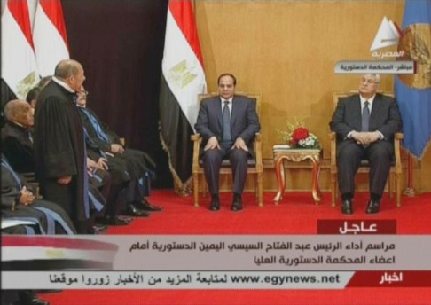 Egyptian President Abdel Fattah el-Sisi (centre) sitting next to interim president Adly Mansour (right) during Sisi's swearing-in ceremony. Photo: AFP