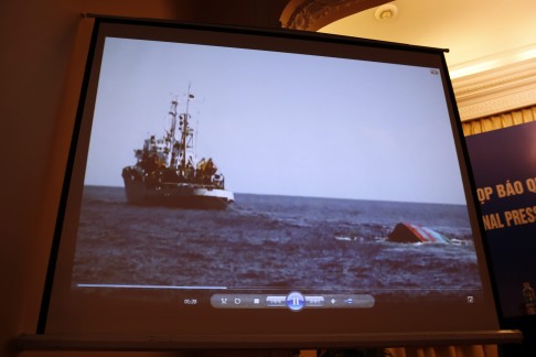 A screenshot of a video played during a press conference shows a Vietnamese boat having sunk after it was allegedly rammed by Chinese vessels near the disputed Paracel Islands on May 26. Photo: EPA