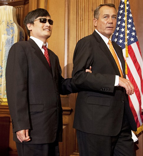 Speaker of the House John Boehner arrives alongside Chinese human rights activist Chen Guangcheng for a press conference in August 2012. Photo: AFP