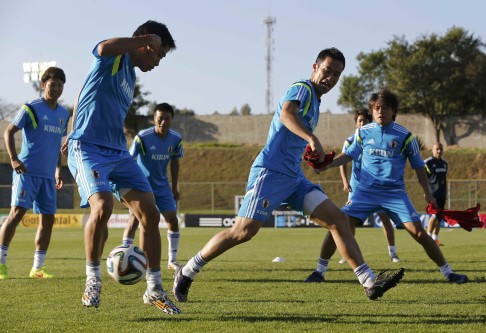 Japan players Masato Morishige (left), Shinji Kagawa, Yasuyuki Konno, Maya Yoshida and Yasuhito Endo get into a training session in the town of Itu northwest of Sao Paulo. Photo: Reuters 