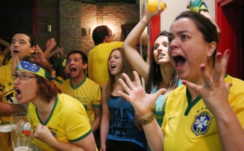 Brazilians cheer on their team at De Belgie in Central yesterday. Photo: Felix Wong