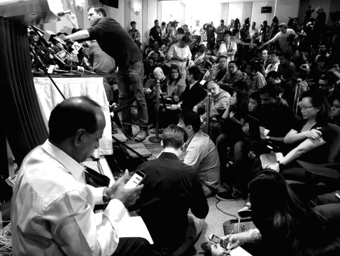 Even though the press conference room was air-conditioned, there were so many people that it was actually hot and fans were brought in to cool down the minister and his team on stage.   