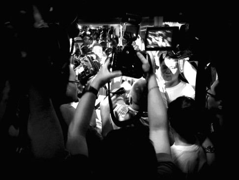 Media scrum as the second batch of Chinese family members who arrived in KL in April take the hotel elevator. Photo: Satish Cheney