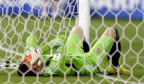 Igor Akinfeev despairs after letting in the opening goal. Photo: AP