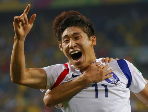 Lee Kuen-ho celebrates opening the scoring. Photo: Reuters