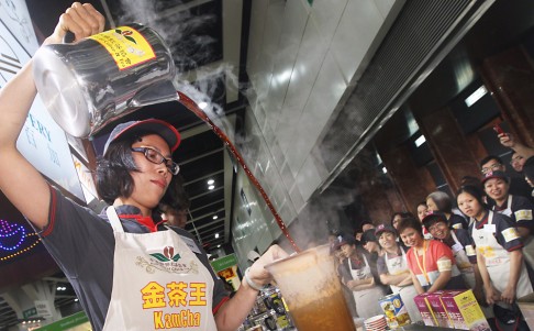 A participant at a milk tea competition. Hong Kong's technique for making milk tea was included on the list. Photo: Sam Tsang