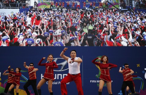 South Korean rapper Psy performs in Seoul during a public screening before the game. Photo: Reuters