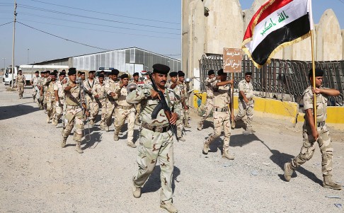 Iraqi Army soldiers parade in Baghdad on Thursday. Photo: AP