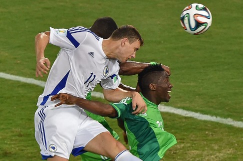 Bosnian forward Edin Dzeko (left) wants to go home on a high, so they will be playing for pride against Iran. Photo: AFP