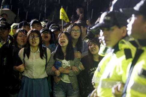 South Korean university student protesters shout slogans during a rally against the government. Photo: EPA