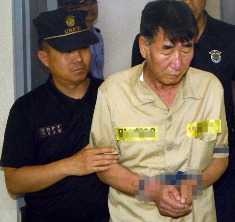 Captain of the sunken ferry Lee Joon-Seok arrives at the trial. Photo: Xinhua