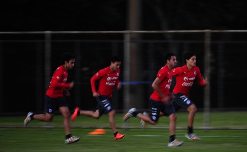 Chile players do sprint drills during training at the Toca da Raposa II centre in Belo Horizonte. Photo: AP 