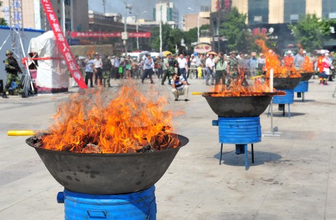 Authorities burn drugs on Thursday in Wuzhong City, in the northwest Ningxia Hui autonomous region. Photo: Xinhua