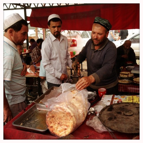 A man sell food at his stand in Hotan, Xinjiang, last year. Photo: Simon Song