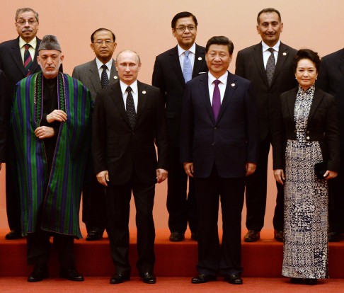 Front, from left: Hamid Karzai, Vladimir Putin and Xi Jinping at the Cica summit in Shanghai in May. Photo: AFP