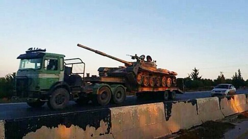 A captured tank on its way to Raqqa. Photo: Screenshot via Twitter