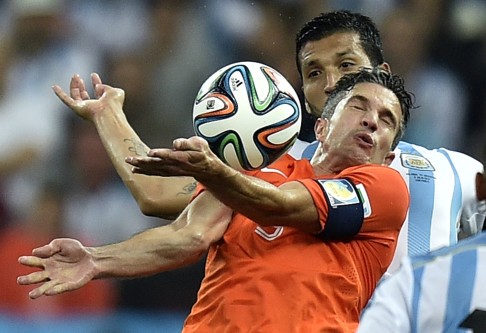 Robin van Persie controls the ball on his chest. Photo: AP