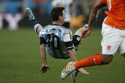 Lionel Messi is sent tumbling. Photo: AFP