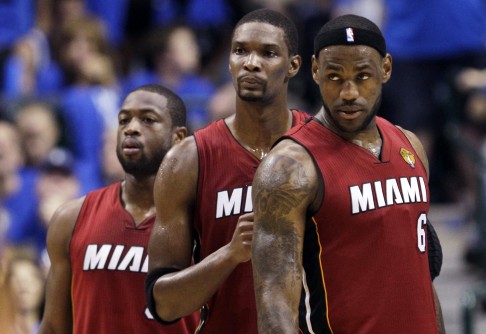 Miami will see their "Big Three" become the "Big Two" next season after LeBron James (right) signed with Cleveland, with Dwyane Wade (left) and Chris Bosh choosing to stay with the Heat. Photo: AP  