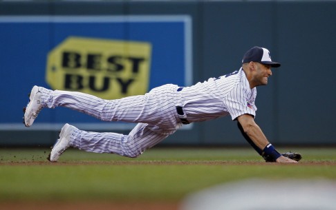 Yankees shortstop Derek Jeter makes a diving throw to first against the National League during the All-Star Game at Target Field. The AL won, 5-3. Photo: MCT)