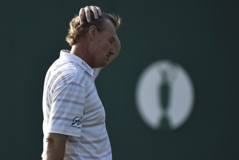 Ernie Els walks off the 18th green after a nightmare seven-over 79. The South African was rattled after hitting a spectator in the face with his opening tee shot. Photo: Reuters