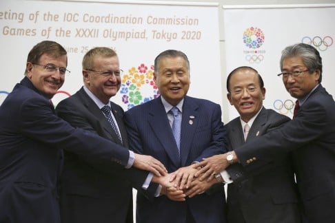 From left, IOC executive director for the Olympic Games Gilbert Felli, IOC vice-president John Coates, Tokyo Olympic organising committee president Yoshiro Mori, chief executive officer Toshiro Muto and IOC member Tsunekazu Takeda join hands after the first coordination commission meeting for the Tokyo 2020 Games. Photo: AP