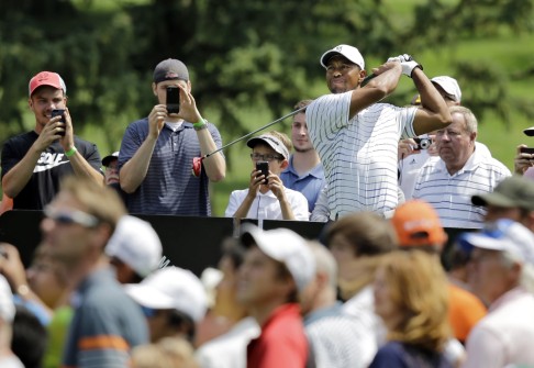 Tiger Woods watches his drive during practice for the Bridgestone Invitational. Photo: AP