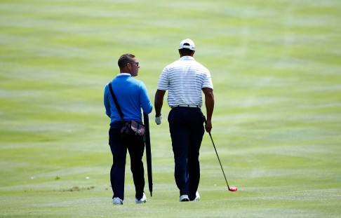 Tiger Woods and swing coach Sean Foley are in deep discussion during a practice round. Photo: AFP