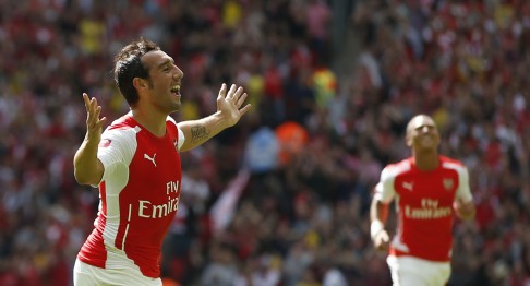 Arsenal's Santi Carzola celebrates after scoring the opening goal of the game against Manchester City. Photo: AP