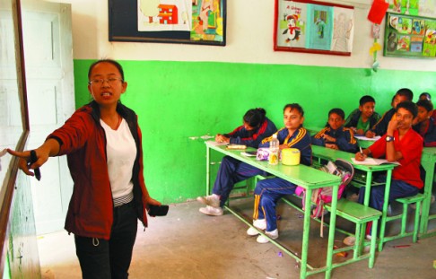 Wu Lijuan from China teaches seventh graders at the city's English Preparatory School.