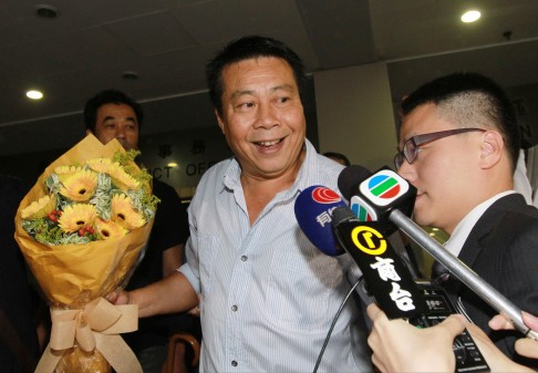 Chan Ngok-yuen with the bouquet that was apparently given to him by supporters. Photo: Edward Wong