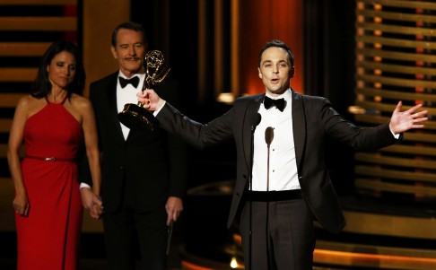 Jim Parsons accepts the award for Outstanding Lead Actor In A Comedy Series for his role in "The Big Bang Theory" as presenters Julia-Louis Dreyfus and Bryan Cranston look on. Photo: Reuters