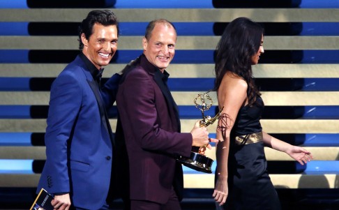 Presenters Matthew McConaughey and Woody Harrelson walk offstage with the award for Outstanding Lead Actor In A Miniseries Or A Movie for Benedict Cumberbatch for his role in "Sherlock: His Last Vow". Photo: Reuters