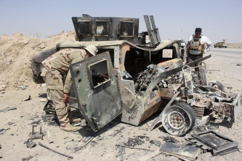 A wrecked Islamic State Humvee. Photo: Reuters