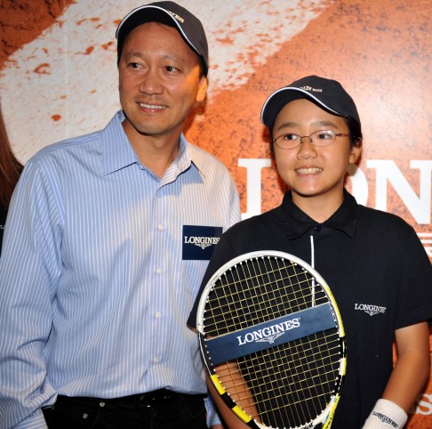 Michael Chang with 13-year-old Justine Leong, who will be heading to the WTA Finals in Singapore. Photo: Xinhua 