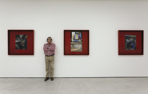 Larry Bell with pieces from his "Light and Red" exhibition at White Cube, in Central.