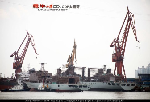 The ship is seen next to a Type 903A replenishment ship.  