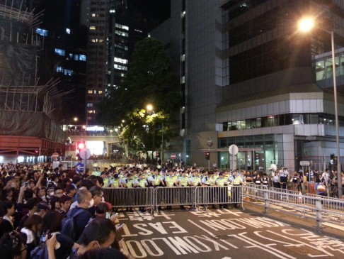 At the wolf's door: protesters have occupied part of a flyover outside police HQ in Arsenal Street, Wan Chai.