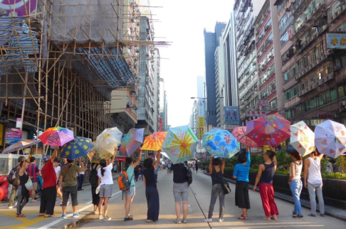 A group of Hong Kong artists painted umbrellas in Mongkok to support the Occupy Central protest, also dubbed as the Umbrella Movement. Photo: Wen Yau
