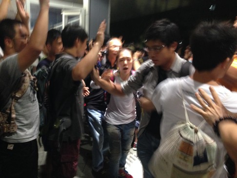 Protesters try to block a man from leaving Civic Square. Photo: Joyce Ng