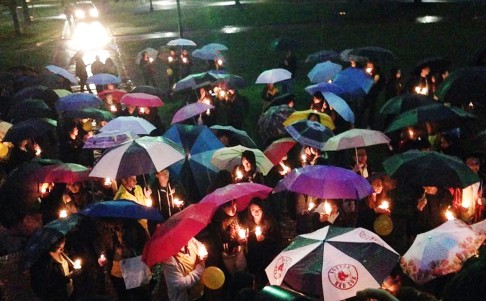 Demonstrators in Boston hold candles and umbrellas in support of the Hong Kong pro-democracy movement. Photo: Leung Yuen Tong