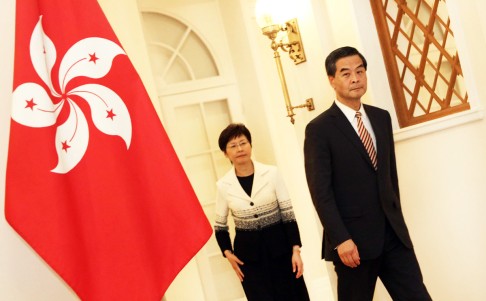 Leung Chun-ying (right) and Carrie Lam arrive for the press conference. Photo: SCMP Pictures