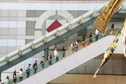 Back to work: people take the footbridge over Harcourt Road in Admiralty. Photo: David Wong