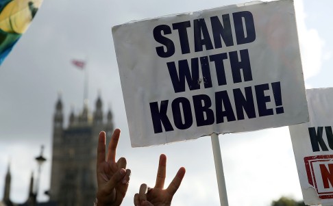 Kurdish supporters demonstrate outside the Houses of Parliament in London, in support of Kurdish fighters in Kobani on Wednesday. Photo: AP
