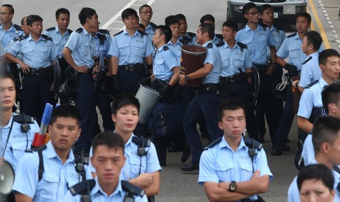 Day five: Police stand guard outside the chief executive's office in Admiralty.